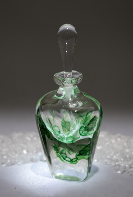 A perfume bottle grass green